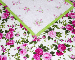 Cerise-patchwork-cot-quilt-centre-corner-detail