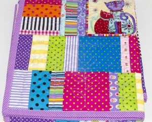 Coolest-Cats-in-Town-patchwork-cot-quilt-folded-Q000115
