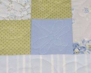 Misty-Blue-patchwork-cot-quilt-dragonfly-detail-Q000100