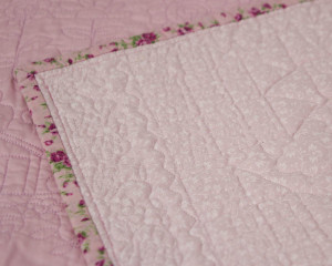 Happy-Days-Pink-cot-Quilt-showing-reverse