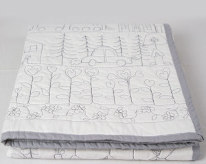 Happy-Days-white-cot-quilt-folded