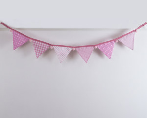 Baby pink bunting with pink pom-poms