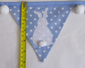 Bunny bunting in blue with white pom-poms flag length