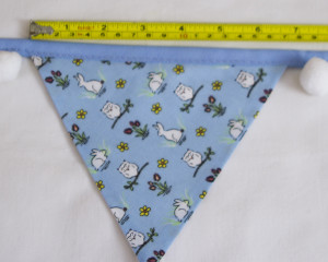 Rabbits and owls blue bunting with white pom-poms flag width