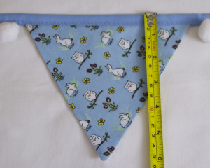 Rabbits and owls blue bunting with white pom-poms flag length