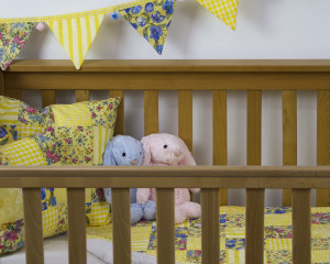 Sunny Day Patchwork Quilt Nursery set shown with separate matching bunting