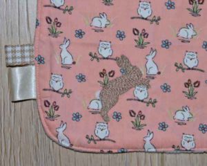 BB010 Peach Rabbits and Owls traditional bib motif and ribbon detail