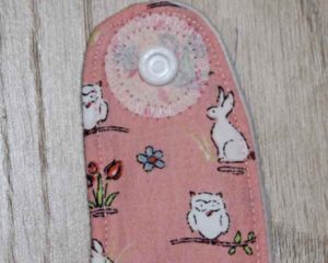 BB010 Peach Rabbits and Owls traditional bib motif and reinforced popper