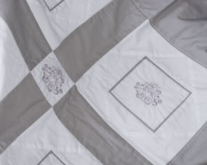 Emblem White and Silver-grey patchwork blanket